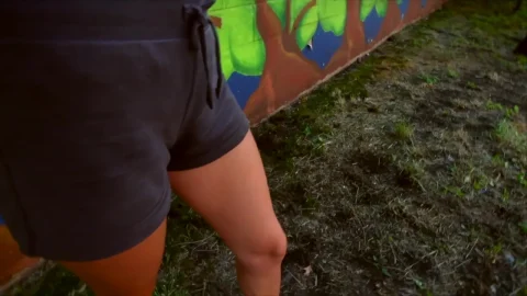 Relaxed Woman Poses in Mural Walls